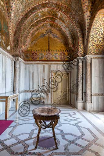 Palermo, The Royal Palace or Palazzo dei Normanni (Palace of the Normans), Pisana Tower,  the King Roger Room: view of the Room which was commissioned by King Roger II d'Altavilla. It is characterized by large mosaic surfaces of great value representing plant elements (palms and banana trees) and scenes of courtly and hunting style, symbols of the Norman power (hunting scenes with archers and deer, peacocks, swans, and mythological centaurs, griffins and other exotic animals including leopards and tigers among luxuriant vegetation). Mosaics are characterised by Greek Byzantiene style (XIII century).