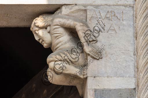 Piacenza, the Cathedral (Duomo), façade, main portal: epistyle corbel with allegory of avarice.