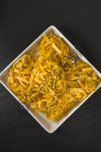  A plate of raw tagliatelle (kind of typical Italian pasta).