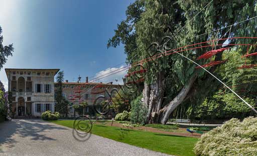   Isola Madre, the Borromeo Palace: the loggia, the Kashmir cypress and "Playtime", artwork by Velasco Vitali.
