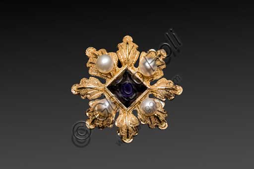   Florence, Penko Bottega Orafa (goldsmith workshop): golden brooch repeating the model of one of the Charites depicted in the Botticelli's "Primavera". This is a classical example of Renaissance florentine jewel. The jewel is enriched by four pearls and a iolite, symbol of force and purity.