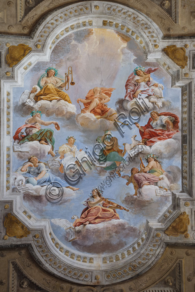 Sassuolo, Este Ducal Palace; Hall of the Guards: the ceiling of the hall with the “Bologna Quarters” by Angelo Michele Colonna, Agostino Mitelli, Baldassarre Bianchi and Gian Giacomo Monti. At the centre: "The Muses present to Apollo the literary works promoted by the Dukes of Este”, work by Angelo Michele Colonna.