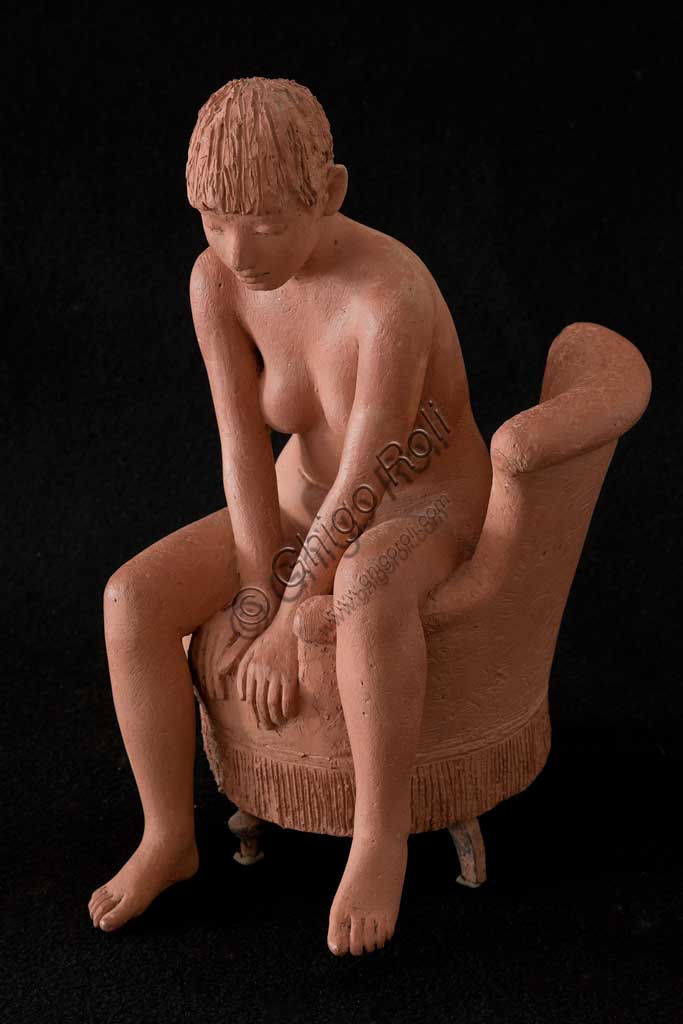 Collezione Assicoop Unipol:  Vittorio Magelli  (1911-1988); "Ragazza seduta su Poltrona"; terracotta, h. cm. 39.