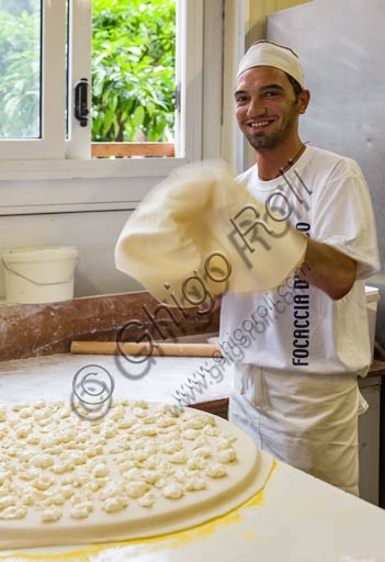  Recco, Moltedo traditional bakery: Lorenzo is  making the Recco focaccia bread, which is filled with stracchino cheese.