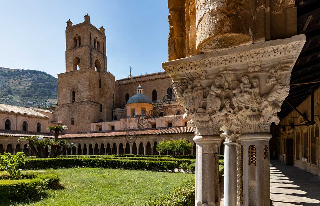  Monreale, Duomo: view of the bell tower of the cathedral. In the foreground, the Southern side of capital E24  of the cloister (Resurrection of Christ and descent to the limbo), XII century.