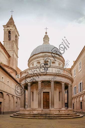 Rome: the "Tempietto"  of San Pietro in Montorio. It is a small commemorative tomb (martyrium) built by Donato Bramante, possibly as early as 1502, in the courtyard of San Pietro in Montorio. Also commissioned by Ferdinand and Isabella, the Tempietto is considered a masterpiece of High Renaissance Italian architecture.