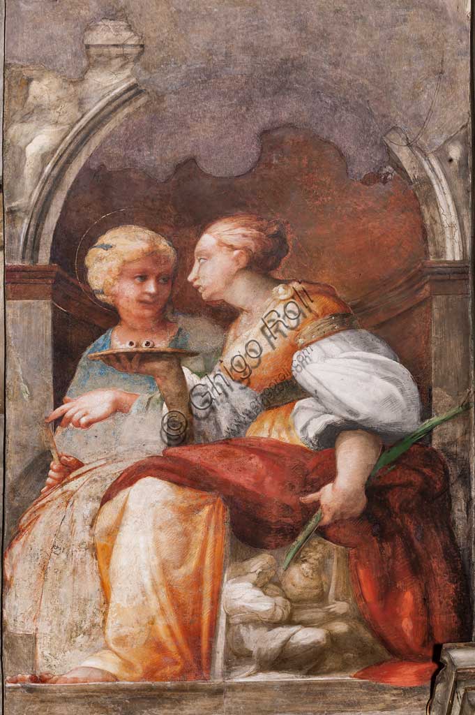 Parma, Church of San Giovanni Evangelista, left aisle, first chapel: "St. Lucia and St. Apollonia",  fresco by Girolamo Francesco M. Mazzola, known as Parmigianino (about 1523).
