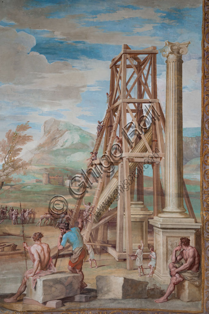 Sassuolo, Este Ducal Palace, the Bacchus Gallery: “Raising the Columns on the River Ganges”.The faux tapestry from which a putto peeks out depicts a vast river landscape dominated in the foreground by the scaffolding of the two Corinthian columns. Bacchus, seated on a boulder, observes the numerous workers with ropes and winches. It is one of the forty-one panels with scenes painted by Jean Boulanger which narrate the events of Bacchus. Wall tempera painting, 1650 - 52.Detail.