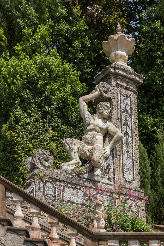 Collodi, Villa Garzoni, the old garden: detail of staircase with statue of satyr.