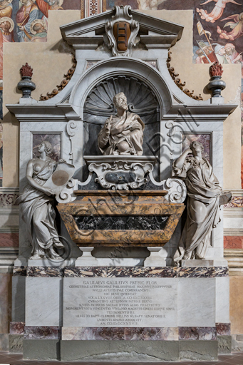 Basilica of the Holy Cross, left aisle: "Sepulchre of Galielo Galilei", 1734-7.It is decorated with a bust by Giovan Battista Foggini (16779 and by the personifications of Astronomy by Vincenzo Foggini and Geometry by Girolamo Ticciati. The surrounding frescoes are remains of the 14th century decoration of the nave, attributed to Mariotto di Nardo.