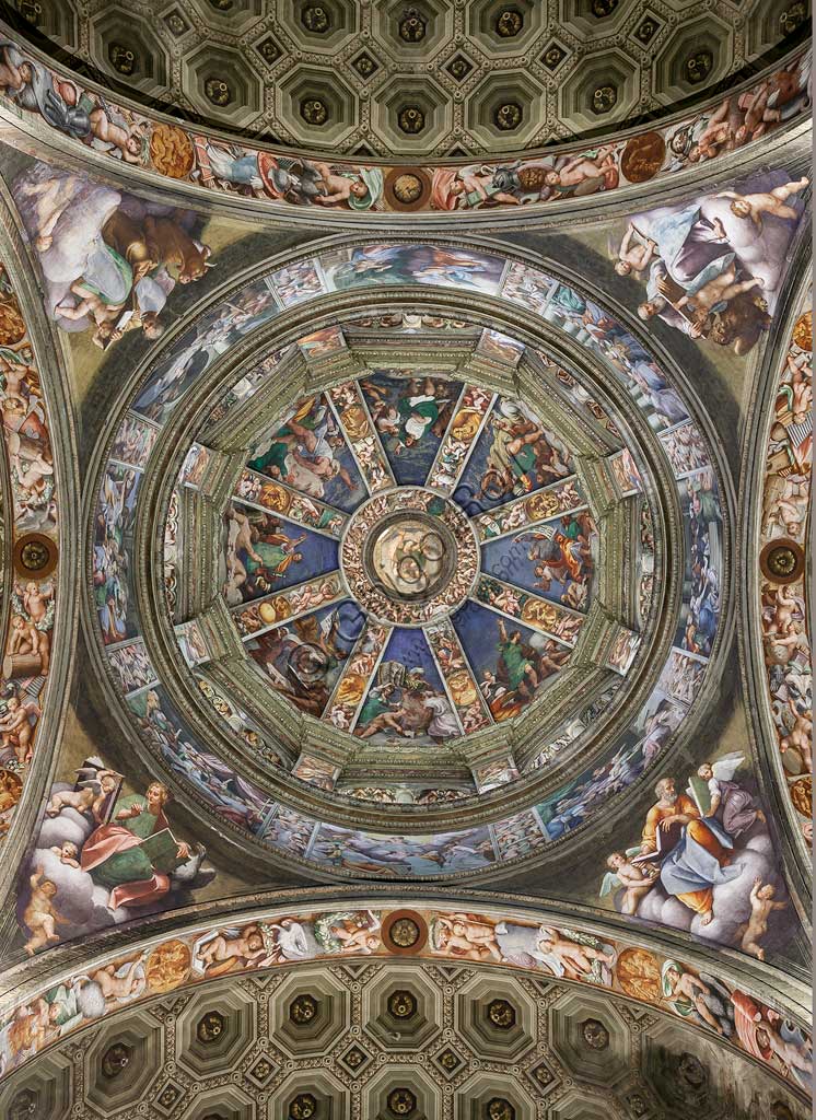 Piacenza, Sanctuary of the Madonna della Campagna: the dome of the transept. The lantern (the skylight) with God the Father, the segments of the cap with the prophets, the frieze with mythological scenes are frescoes by Giovanni Antonio de Sacchis, known as il Pordenone  (1530 -1532). The eight panels of the tambour with stories of the Virgin, and the pendentives with the Evangelists, are frescoes by Bernardino Gatti, known as "the Sojaro" and helpers, 1543.