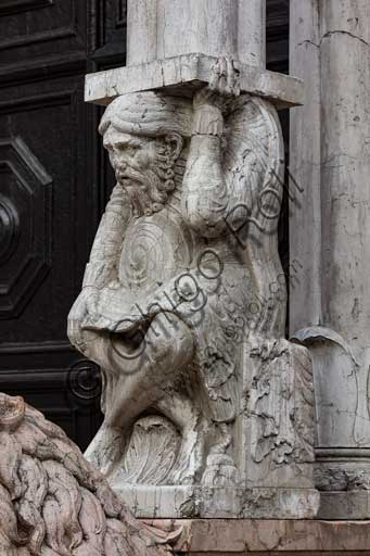 Ferrara, the Cathedral dedicated to St. George, façade: detail with telamon supporting the prothyrum.