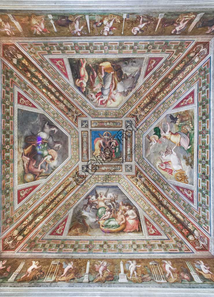 Ferrara, the Castello Estense (the Estense Castle), also known as Castle of St. Michael: view of the ceiling of the Aurora hall: at the centre "Time (Cronus)", aroundframes  with Dawn, Day, Sunset and Night. Work by Bastianino and Ludovico Settevecchi. The cornices which are decorated with putti are by Leonardo da Brescia. The Chamber, former Ercole II's private room, was known in 1600 as the mirror chamber. It gives the name to the  whole representation apartment that Alfonso II wanted. The vault scenes are thought to be the allegory of human life.