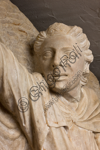 , Genova, the Diocesan Museum: the funeral monument of Cardinal Luca Fieschi, by the worskhop of Giovanni di Balduccio from Pisa, about 1336.Detail of an angel's head.