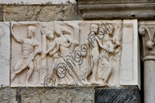 , Genoa, Duomo (St. Lawrence Cathedral), West side, the façade, the right tower: frontal portion of Roman sarcophagus with "The funeral procession of Meleager" (180 - 190 d.C.).