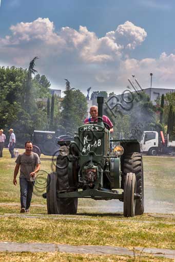 Old Tractor at a gathering of vintage vehicles.Make: HSCS (Hofherr - Schrantz - Clayton - Shuttleworth)Model: K44-48Year: 1938 - 1942Fuel: crude oil and/or diesel oilNumber of Cylinders: Displacement: about 10.600 ccHorse Power: 44 HP at the wheel and 48 HP  at the PTO (Power Take-Off)Characteristics: 2-stroke diesel cycle. It had been used in the Second World War to pull the cannons, but then it was abandoned because it made too much noise and signaled the vehicle to the enemies.