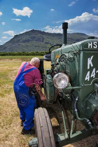 Old Tractor.Make: HSCS (Hofherr - Schrantz - Clayton - Shuttleworth)Model: K44-48Year: 1938 - 1942Fuel: crude oil and/or diesel oilNumber of Cylinders: Displacement: about 10.600 ccHorse Power: 44 HP at the wheel and 48 HP  at the PTO (Power Take-Off)Characteristics: 2-stroke diesel cycle. It had been used in the Second World War to pull the cannons, but then it was abandoned because it made too much noise and signaled the vehicle to the enemies.