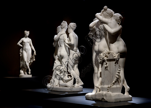  Three statuary groups: in the foreground, "The three Graces", 1812-17, by Antonio Canova (1757 - 1822), marble statue. At the centre,  "The Graces and Cupid", 1820 -22 by Bertel Thorvaldsen (1770-1844) . In the background, "Dancing Terpsichore (Dancer), 1820, di Gaetano Matteo Monti (1776 - 1847).