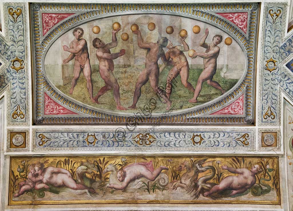 Ferrara, the Castello Estense (the Estense Castle), also known as Castle of St. Michael: detail of the ceiling of the Hall of Games,"The trigonale (ability games with the ball)". The frescoes are designed by Pirro Ligorio. The realization of "Trigonale" is by Ludovico Settevecchi.
