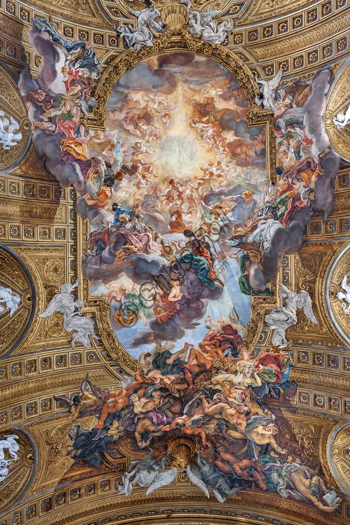 Church of Jesus, the interior: view of the vault of the nave with "The Triumph in the Name of Jesus", fresco by Giovan Battista Gaulli known as Baciccia, 1679. The golden cornice and the plasters are by Ercole Antonio Raggi.