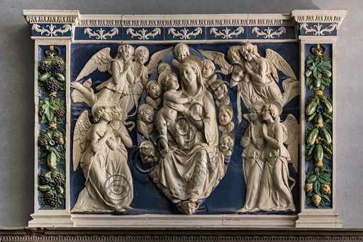  "The Virgin Mary and the Infant Jesus surrounded by angels", by Della Robbia's workshop, glazed terracotta.