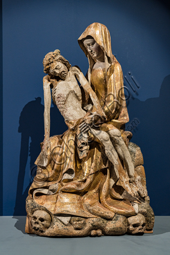 “Vesperbild” (Lamentation), walnut wood sculpture from 1380-1400 from the Rhine valley, cradle of the Vesperbild sculpture that was born here in the 14th century. The Virgin sits on Golgotha, in which two skulls are embedded.